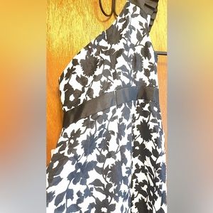 NWT Black and white one shoulder dress. Knee length wrap dress.